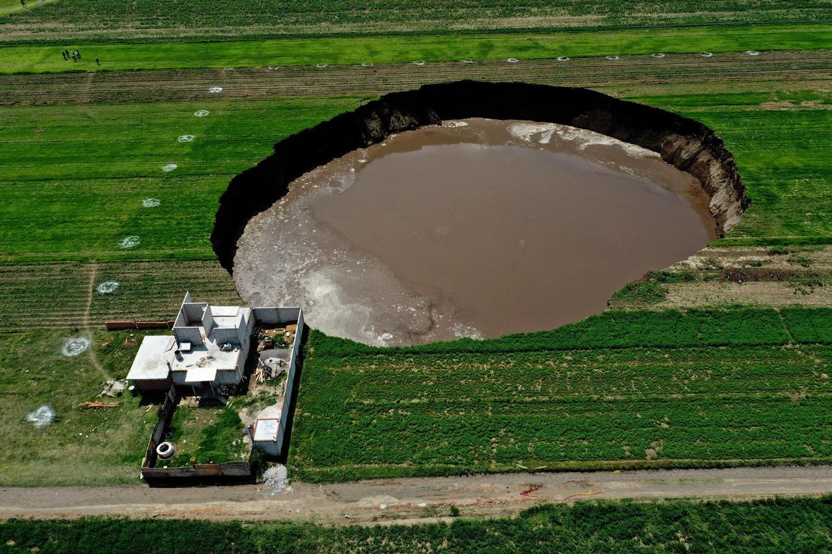 As early as June 1, the crater moved dangerously close to home in the area, as this photo shows. 