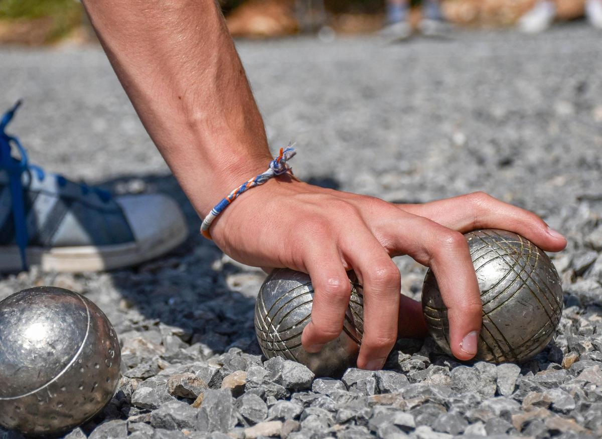 Petanque is a sport.  You don't always have to bend over.
