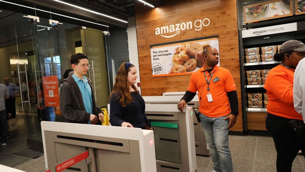 In Amazon Go stores, customers don't have to do anything except take their purchases off the base.