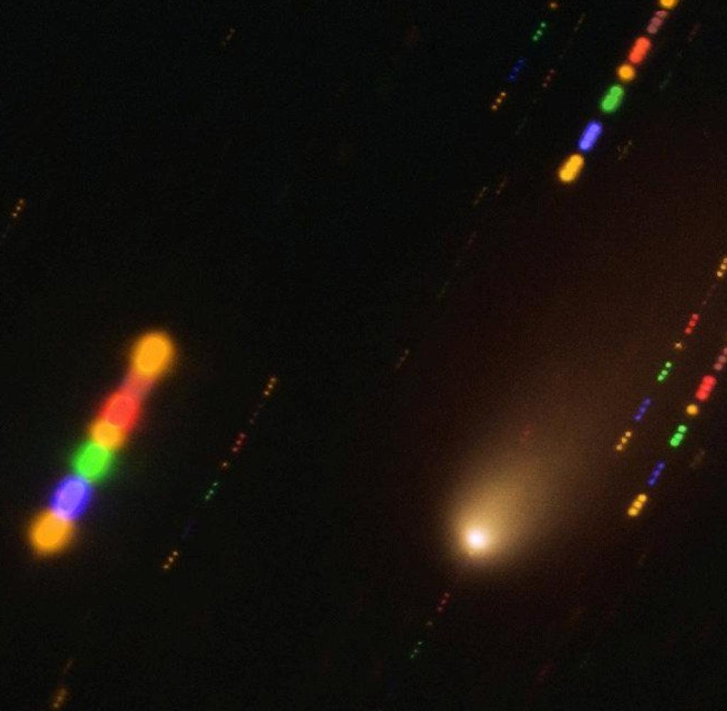 This image was taken with the FORS2 instrument on ESO's Very Large Telescope in late 2019, when Comet 2I/Borisov passed close to the sun.  As the comet was traveling at a breakneck speed, about 175,000 kilometers per hour, the background stars appeared as streaks of light as the telescope followed the comet's path.  The colors in these lines give the image some flair and are the result of combining notes in different wavelength ranges, highlighted by the different colors in this composite image.