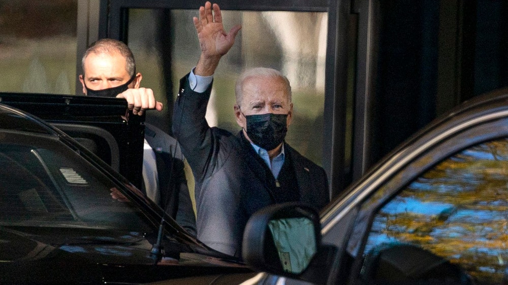 Joe Biden, President of the United States, waves on November 19 on his way to Walter Reed National Military Medical Center, where he has an appointment for a medical exam.