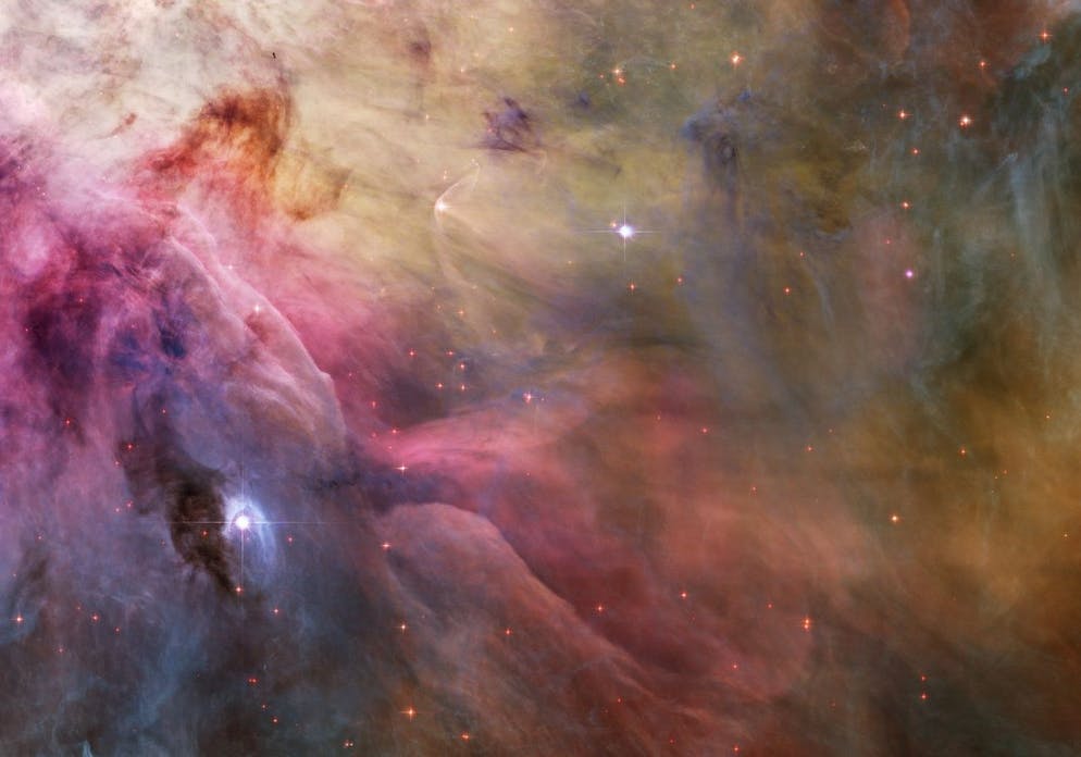 epa03569091 An undated flyer image provided by NASA on Feb. 05, 2013 showing a view of cosmic clouds and stellar winds showing LL Orionis, interacting with the outflow of the Orion Nebula, as NASA describes.  Adrift in the Orion stellar nursery and still in its formative years, the variable star LL Orionis produces winds that are more energetic than winds from our middle-aged sun.  When fast stellar winds flow into slow-moving gas, a shock front is formed, similar to the bow wave of a boat moving in water or an airplane traveling at supersonic speed.  The small, curved structure, just above left of center is LL Ori's cosmic bow shock, which is about half a light-year in diameter.  The slower gas flows away from the hot central star cluster of the Orion Nebula, the Trapezium, located off the upper left corner of the image.  In three dimensions, the LL Ori's wrap-around shock front is shaped like a bowl that appears even brighter when viewed along the rim. 