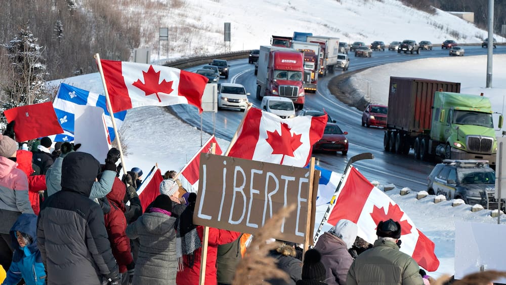Rebel truck drivers: a protest train of a truck runs through Canada