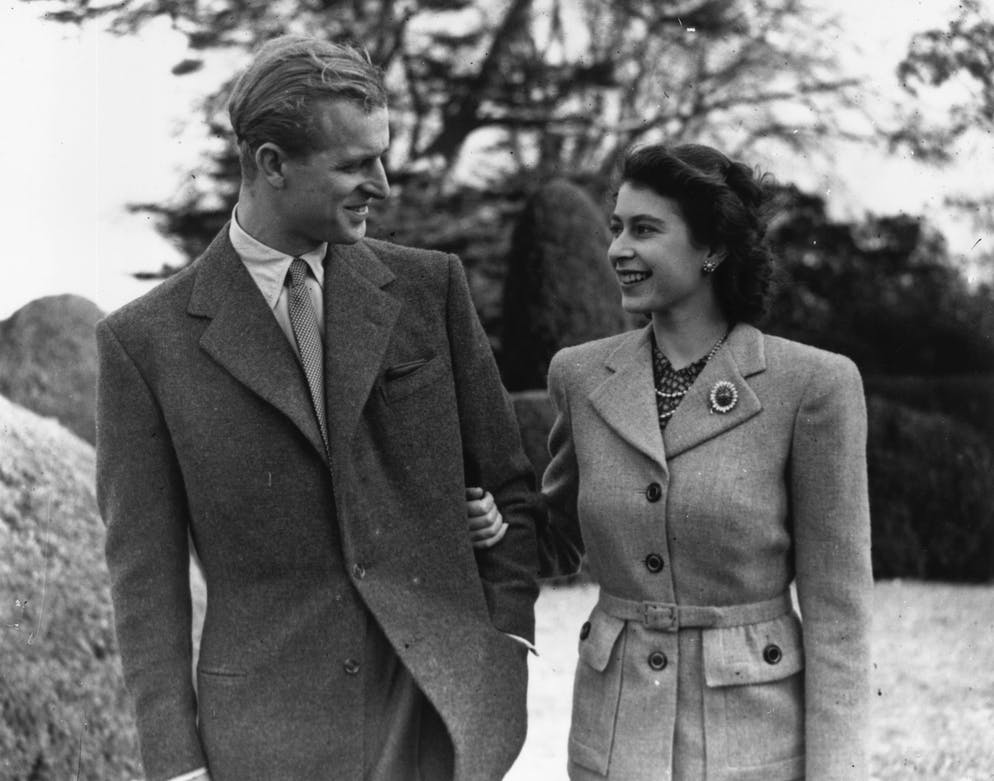 November 24, 1947: Princess Elizabeth and Prince Philip, Duke of Edinburgh, enjoy a walk during their honeymoon in Broadlands, Rumsey, Hampshire.  (Photo by Topical Press/Getty Images)