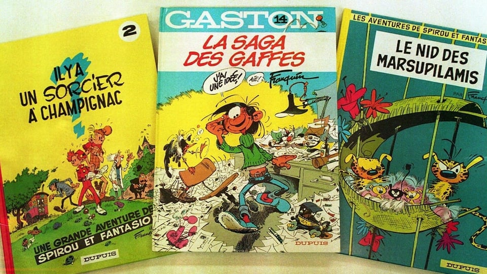 Three comic books, one from Spirou and Fantasion, one from Marsupilami and one from Gaston