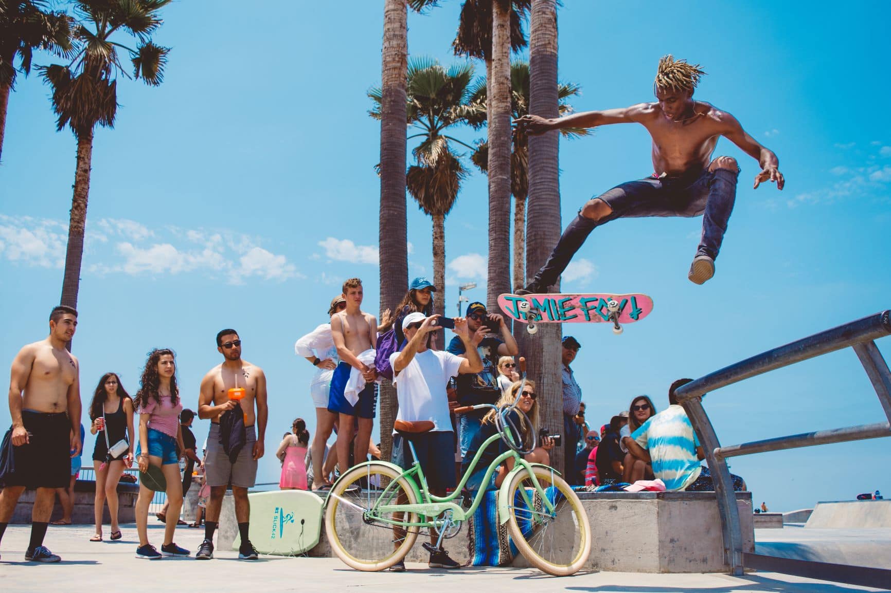 Surfers in front of spectators on Venice Beach in Los Angeles