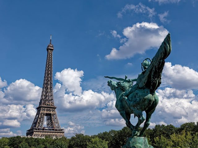 Eiffel Tower and statue.