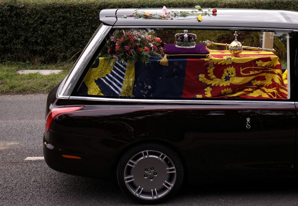The coffin in the black car