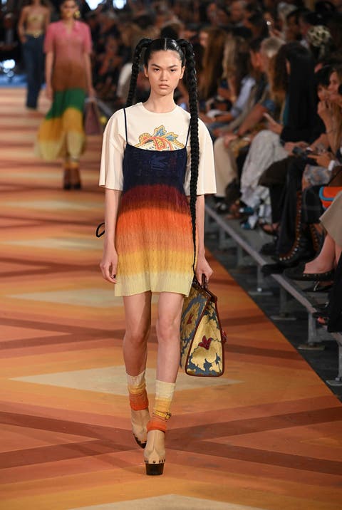 Tote bags complete the Etro's supermodel look.  Image credit: Getty Images